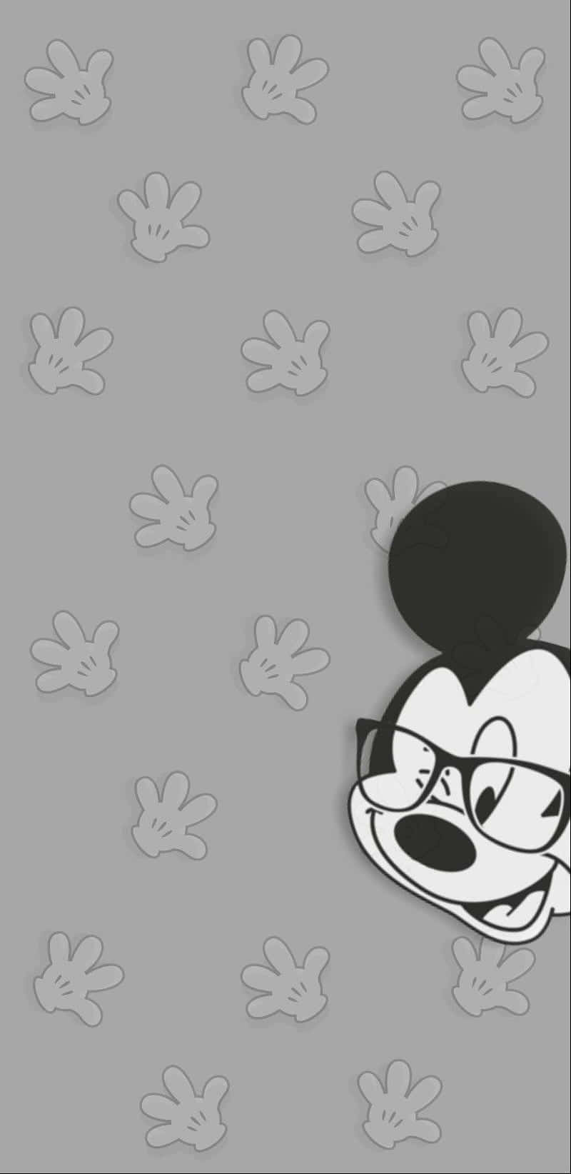 Enjoy The Classic Disney Character Mickey Mouse On Your Phone Wallpaper