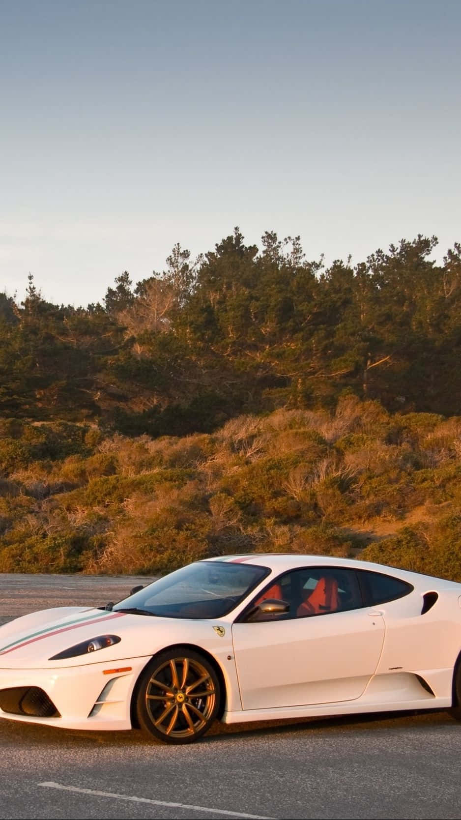 Enjoy The Life Of Luxury With A White Ferrari Iphone Wallpaper