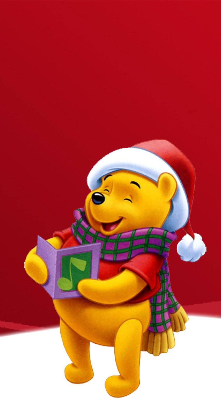 Enjoy The Magic Of Christmas With Winnie The Pooh Wallpaper