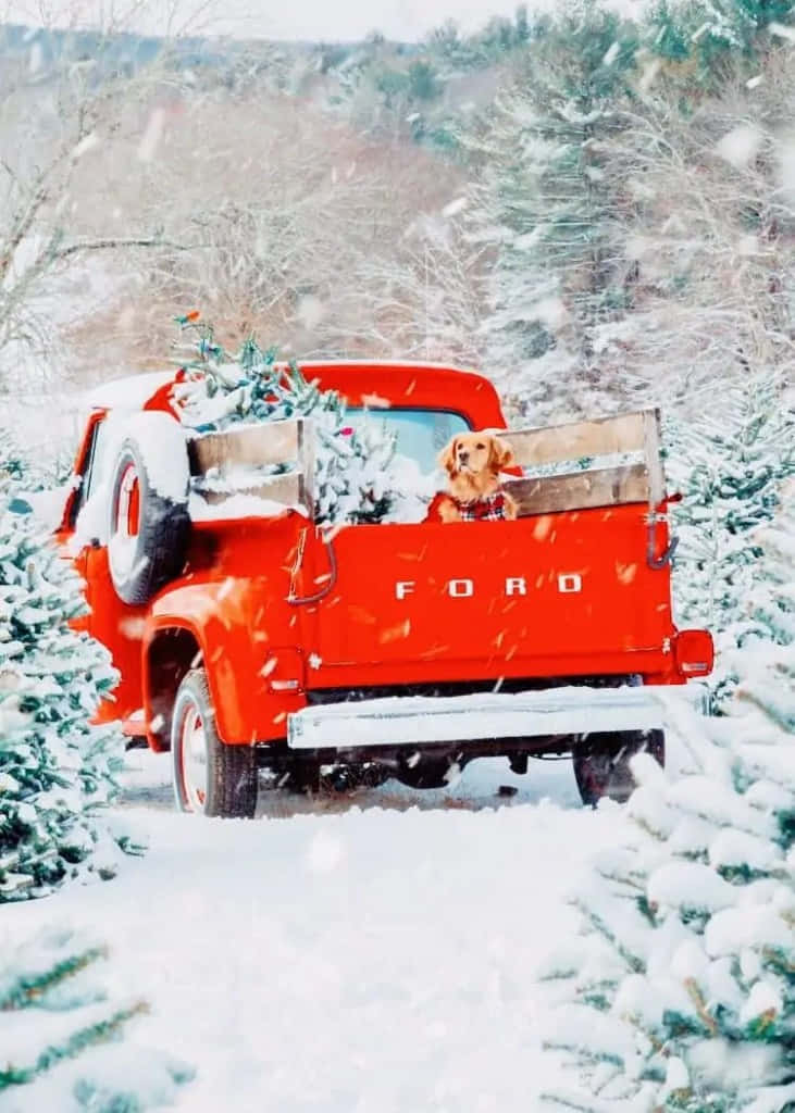 Enjoy The Magical Holiday Spirit With A Vintage Truck Christmas Wallpaper