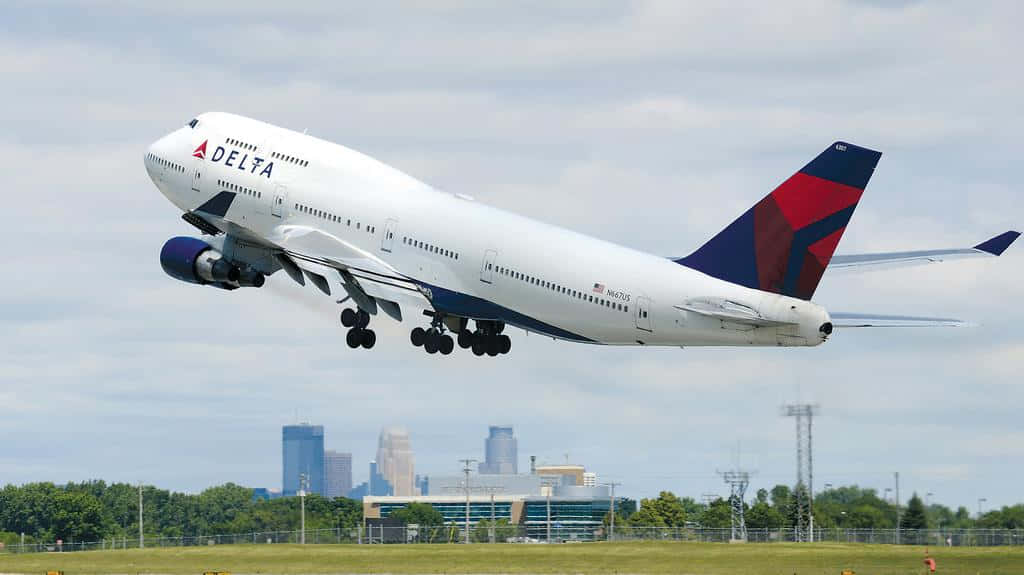 Enjoy The Panoramic View Of A Jumbo Jet Wallpaper