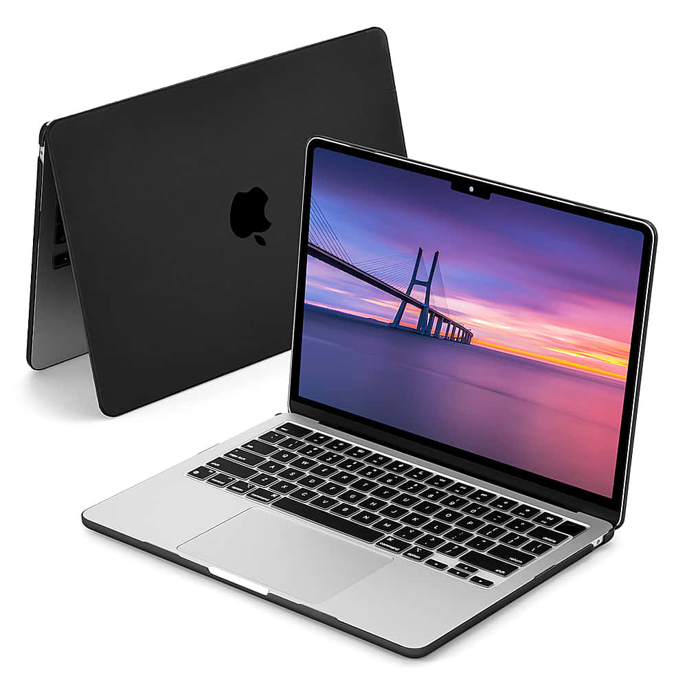 Enjoy The Sleek Design Of The Black Macbook! Wallpaper