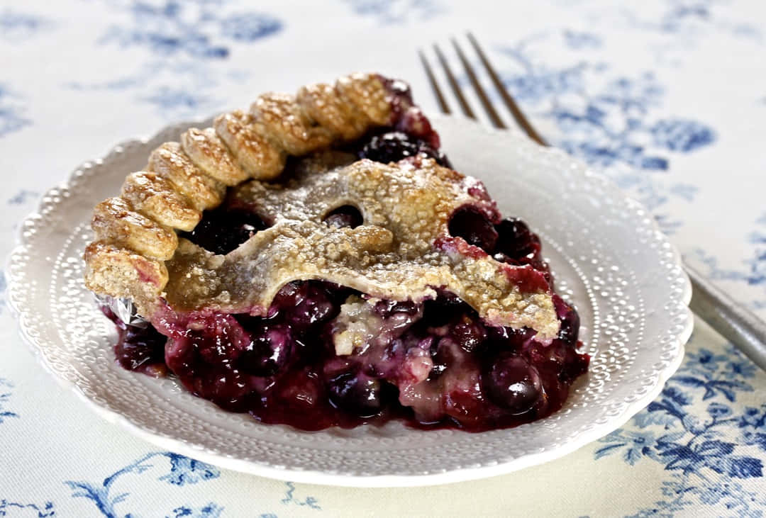 Enjoy The Sweet Taste Of Home-baked Blueberry Pie Wallpaper