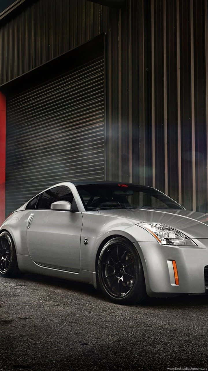 Enjoy The Thrill Of Driving The Nissan 350z With Your Iphone. Wallpaper