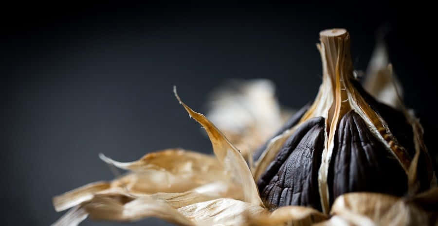 Enjoy The Unique Taste Experience Of Black Garlic Wallpaper