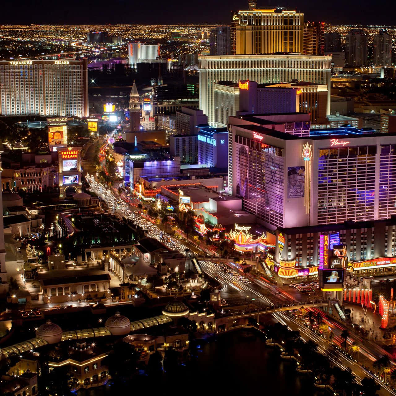 Enjoy The Vibrant Nightlife Of Las Vegas From The Comfort Of Your Phone. Wallpaper