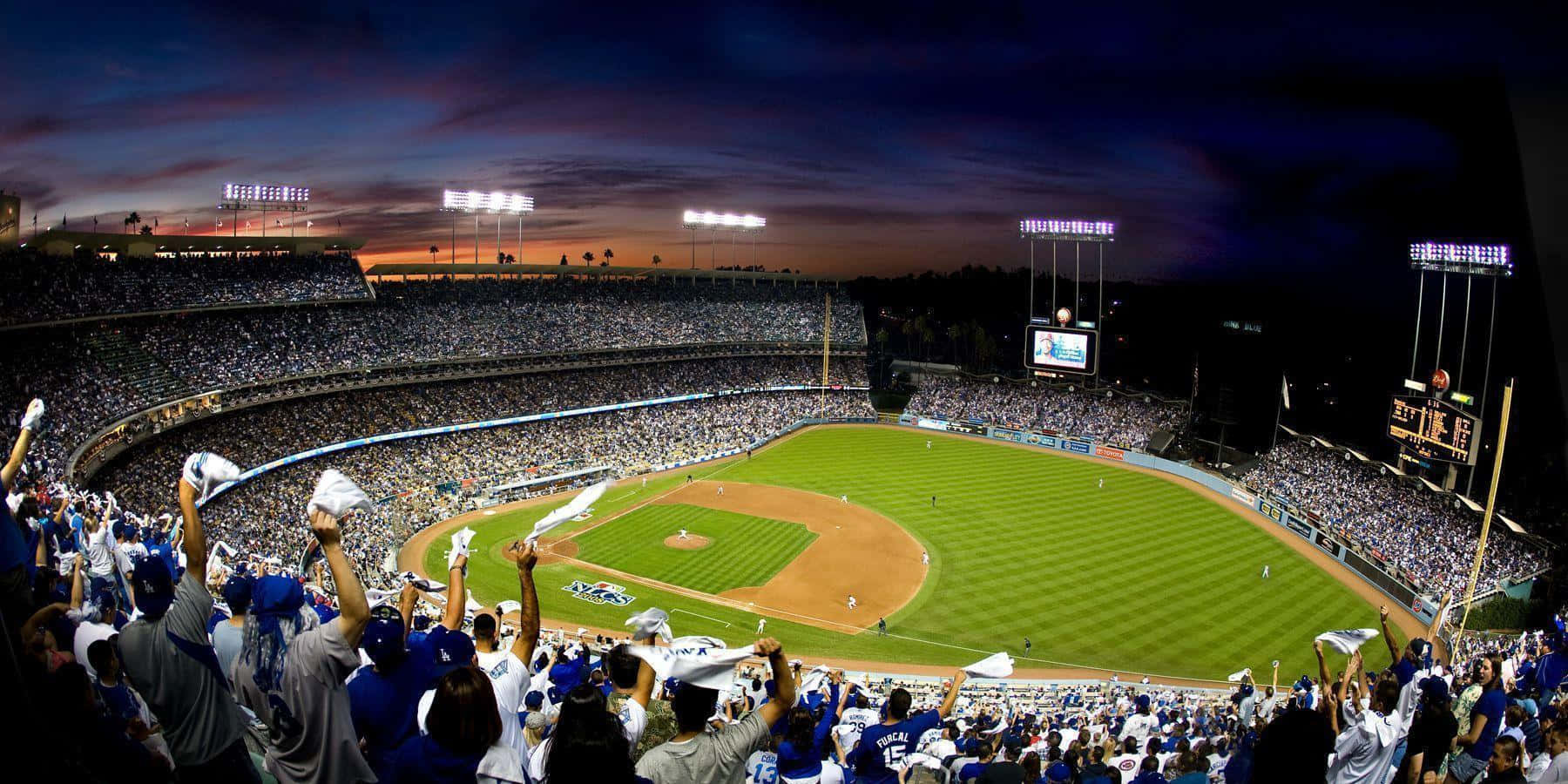 Enjoying The Beautiful Evening Skyline At Dodger Stadium Wallpaper