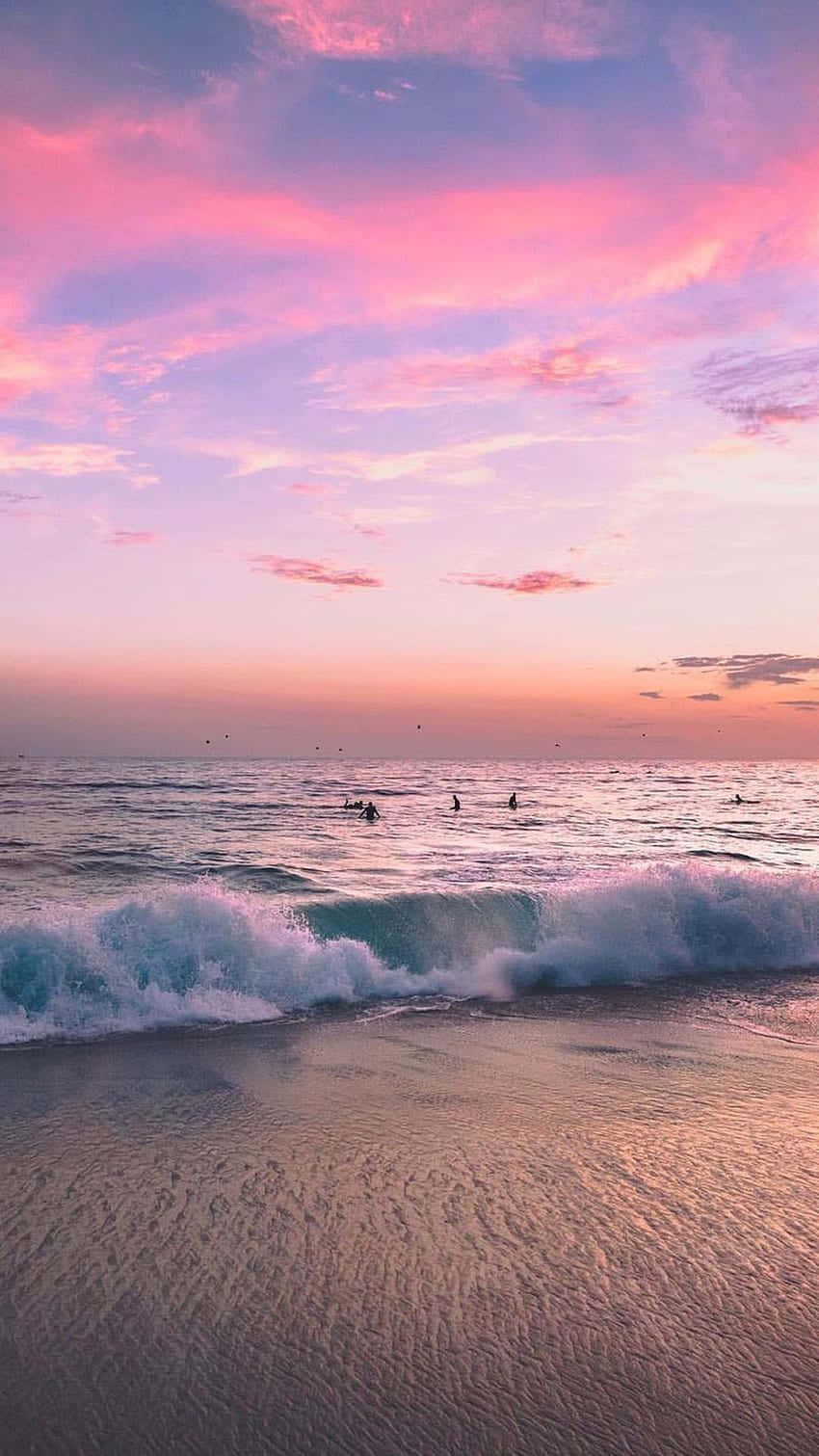 Enjoying The View Of The Beautiful Beach Under The Bright Blue Sky. Wallpaper