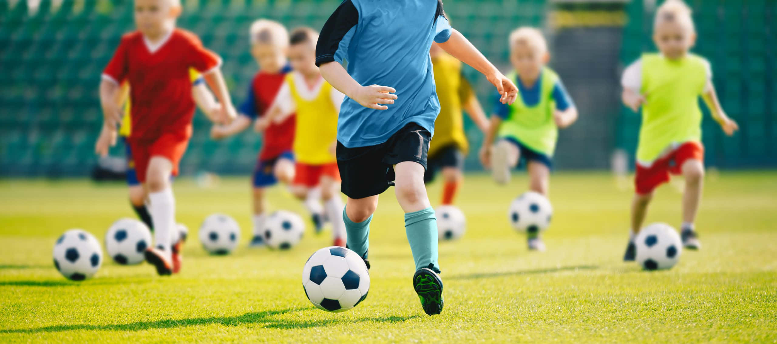 Enthusiastic Young Soccer Players In Action Wallpaper