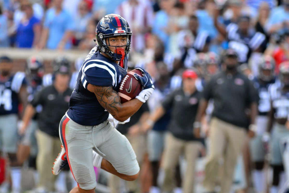 Evan Engram Football Game Action Wallpaper