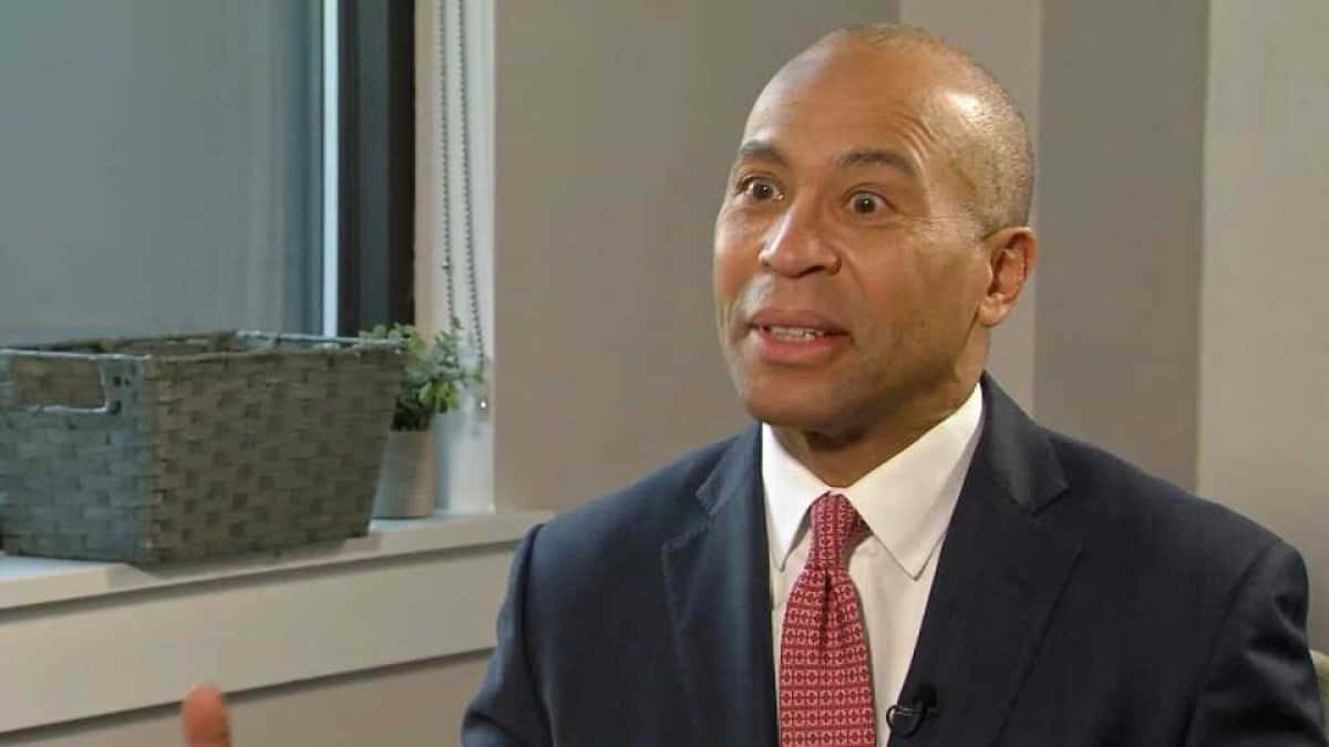 Ex-governor Deval Patrick Engaged In A Deep Conversation Wallpaper