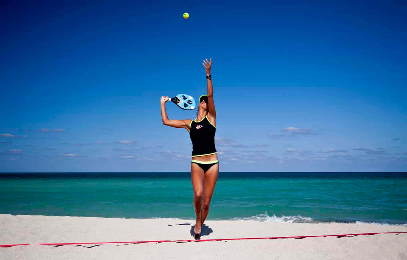 Exciting Game Of Beach Tennis In Action Wallpaper