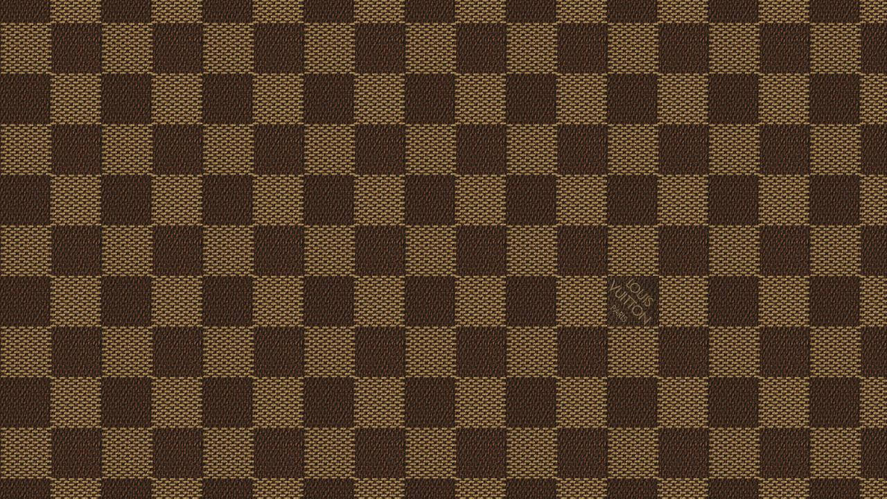 Experience The Timeless Style Of Louis Vuitton With This Classic Checkered Design Wallpaper