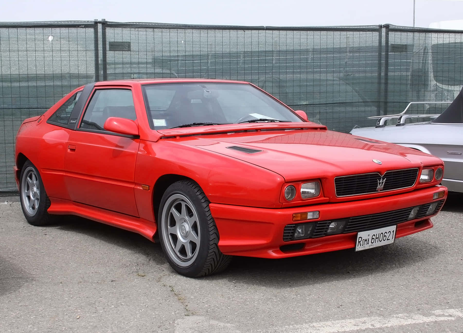 Exquisite Beauty Of Maserati Shamal Under Twilight Skies Wallpaper