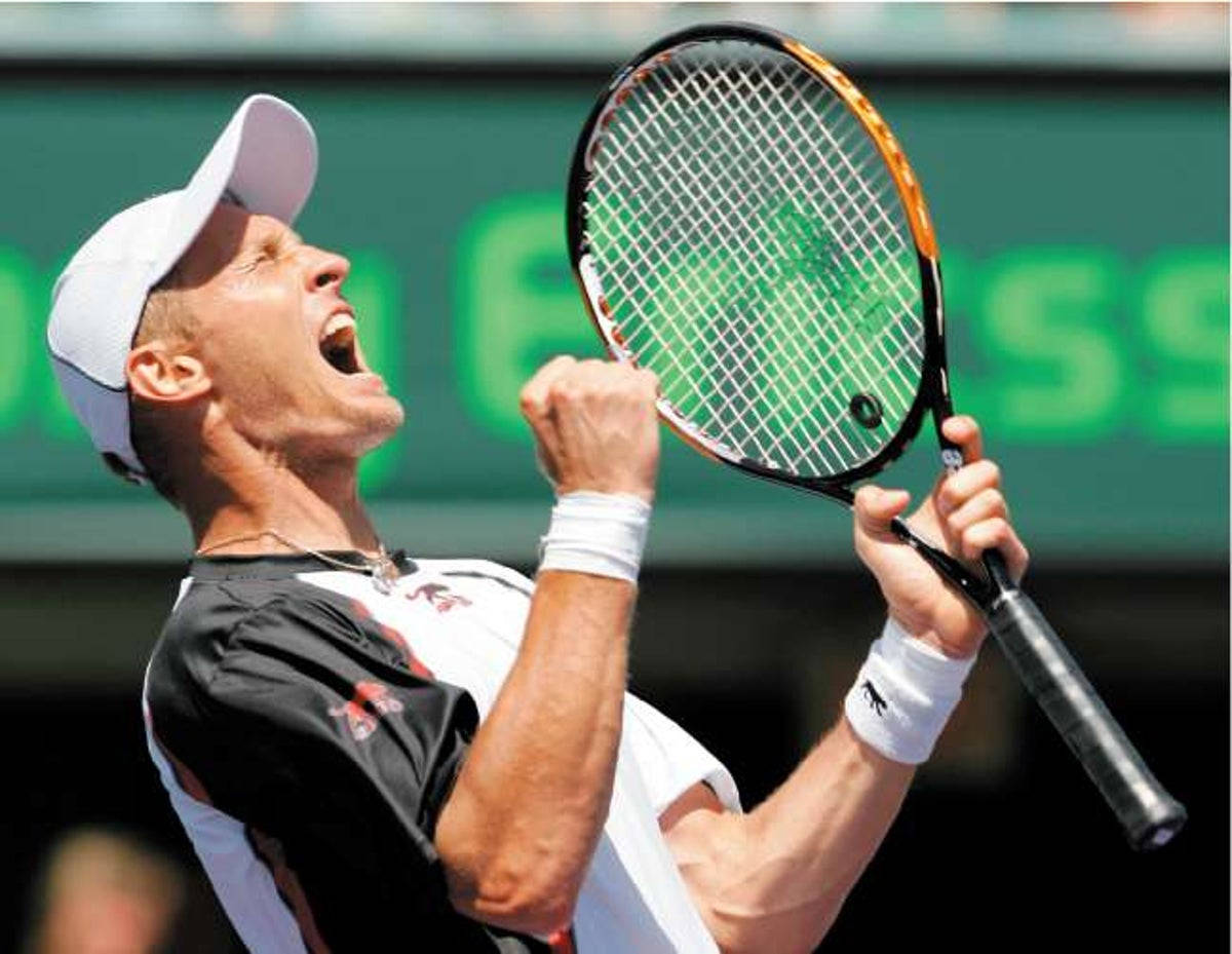 Exuberant Nikolay Davydenko Expressing Joy During A Tennis Match. Wallpaper