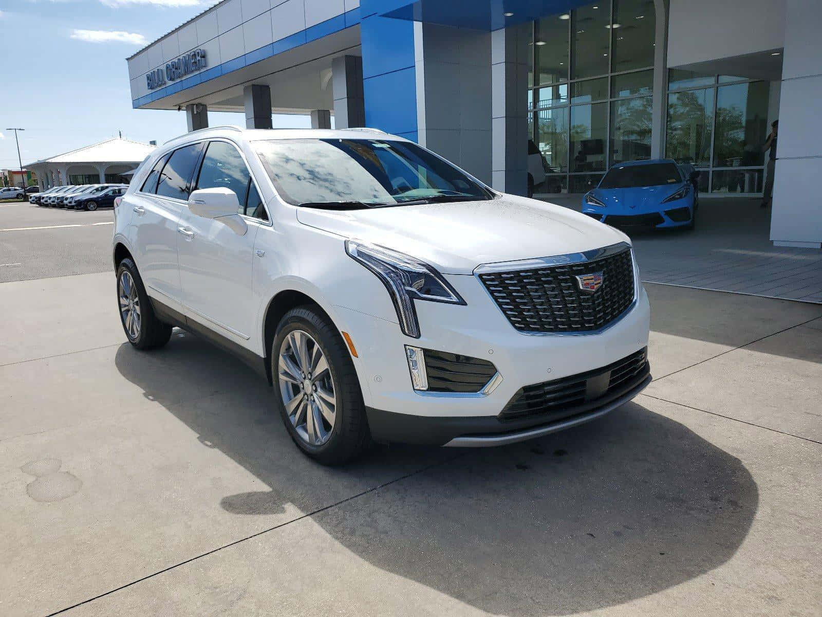 Eye-catching Cadillac Xt5 On Scenic Road Wallpaper