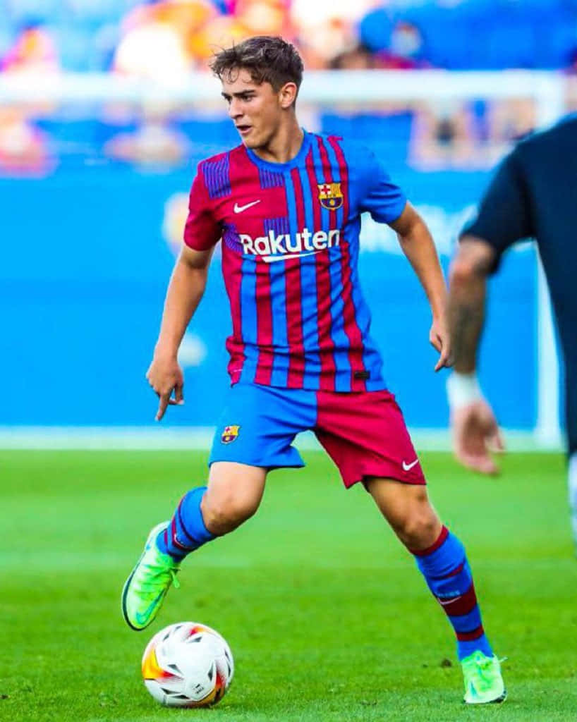 F C Barcelona Midfielder Action Shot Wallpaper