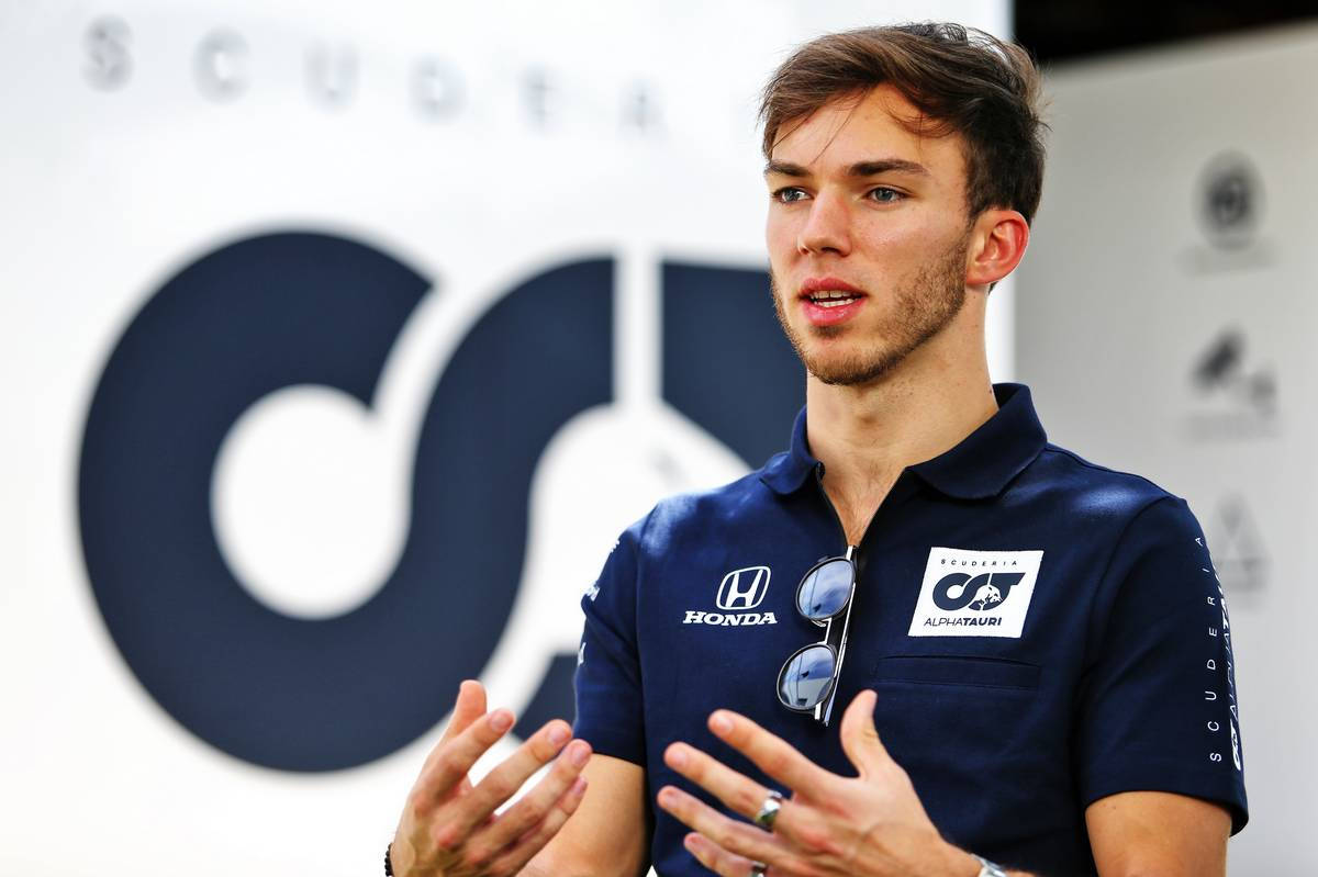 F1 Driver Pierre Gasly Deep In Conversation Wallpaper