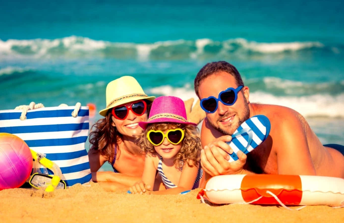 Family Enjoying Spring Vacation By The Beach Wallpaper