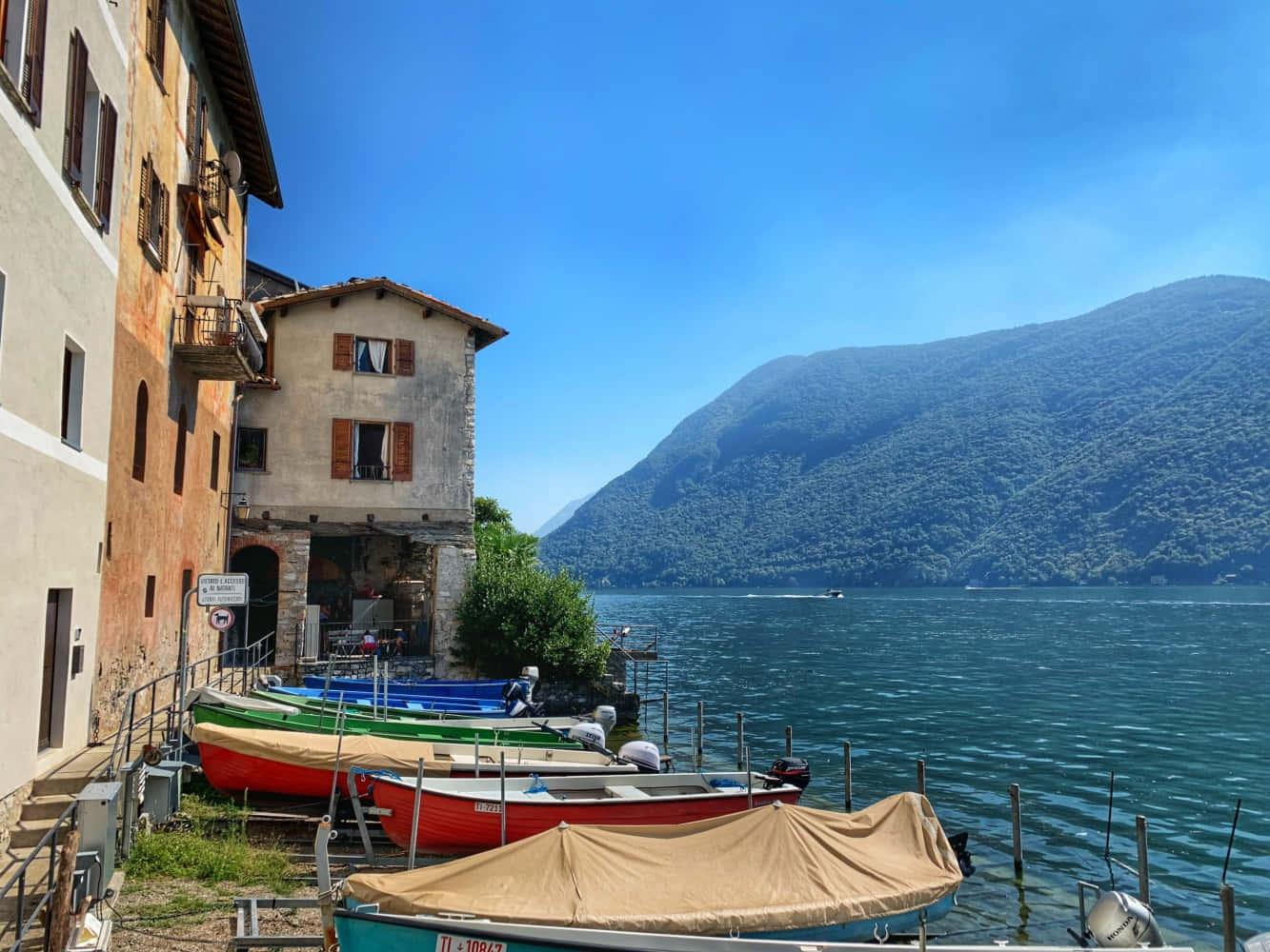 Fantastic Sceneries Of Lugano Reflecting On The Tranquil Lake Wallpaper