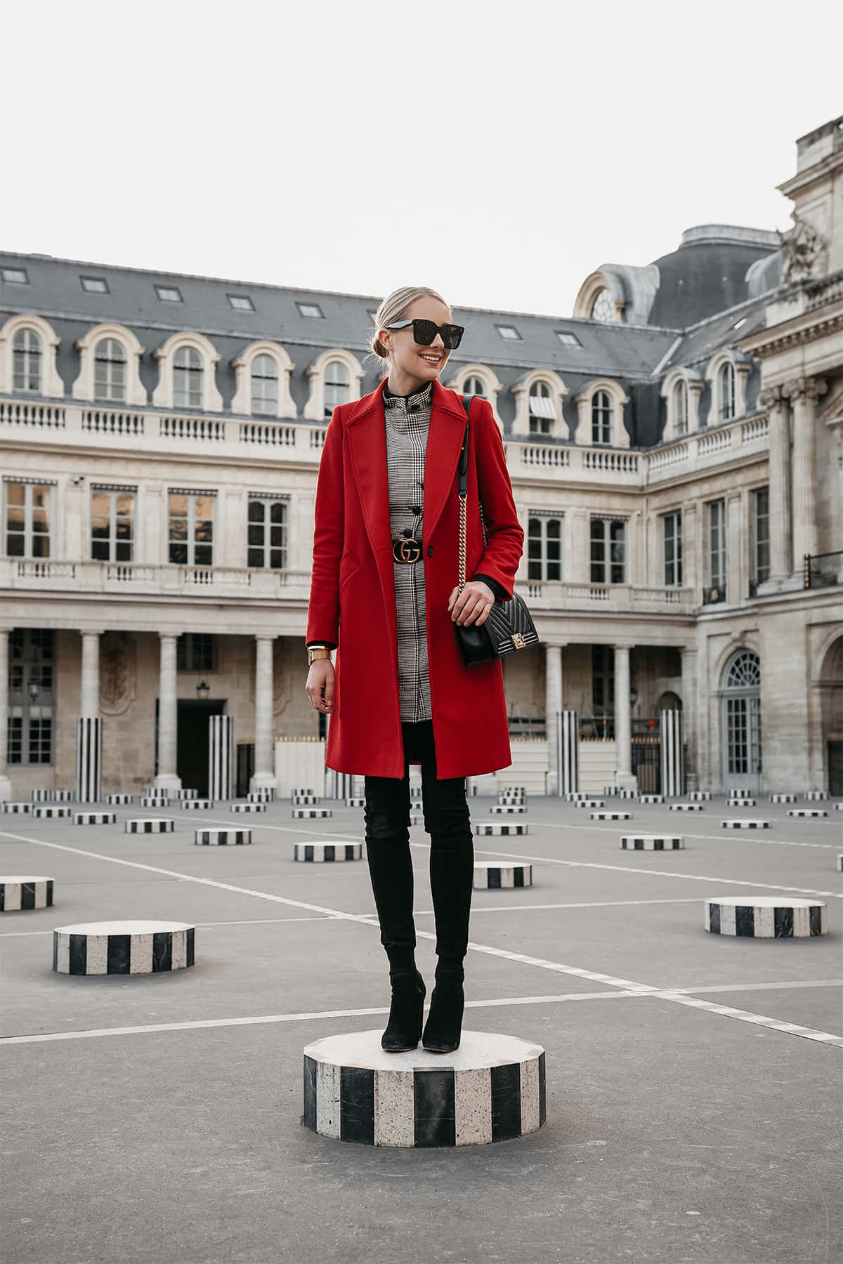 Fashionable Woman In A Red Coat At The Park Wallpaper