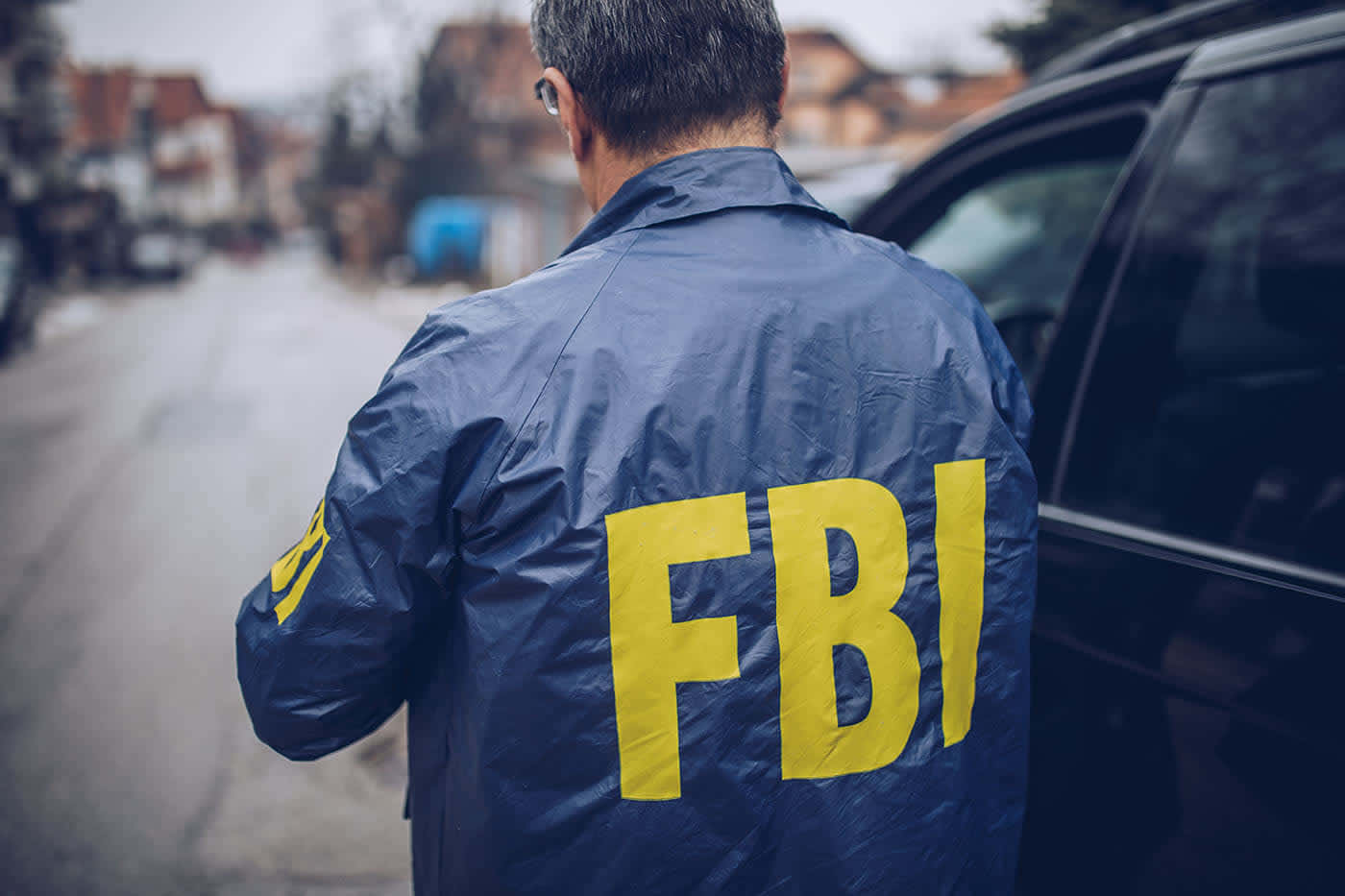 Fbi Agent Standing Next To A Car Wallpaper