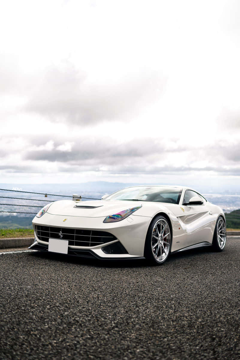 Feel The Wind In Your Hair As You Cruise Down The Highway In This Sleek White Ferrari Wallpaper