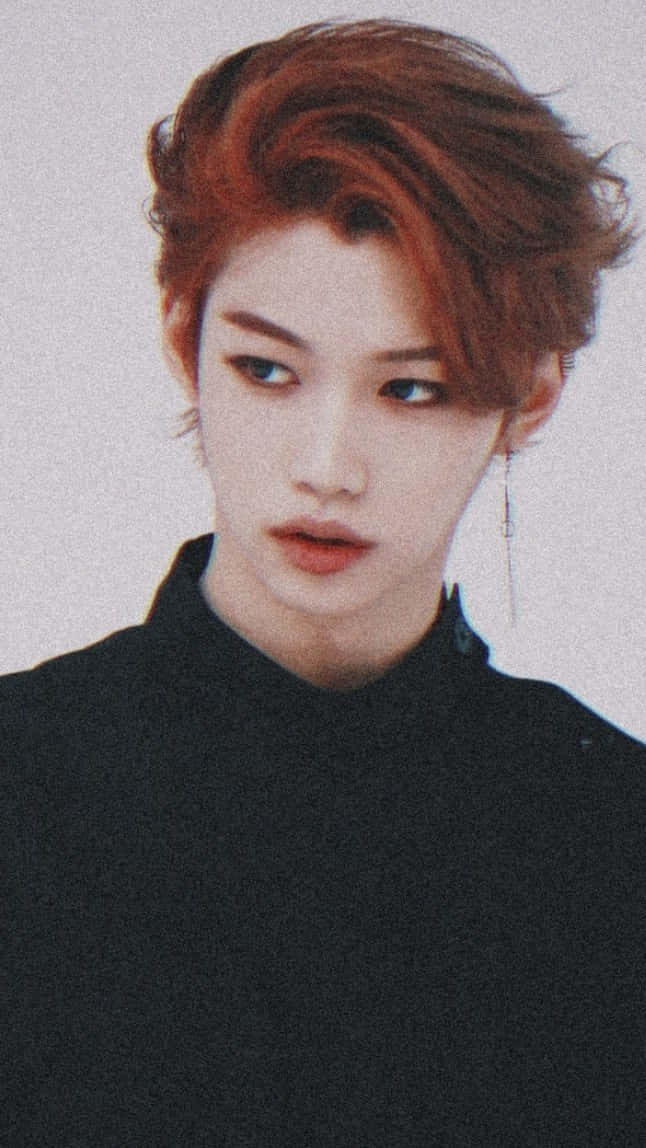 Felix From Stray Kids Looking Goofy And Dapper In Pink Wallpaper