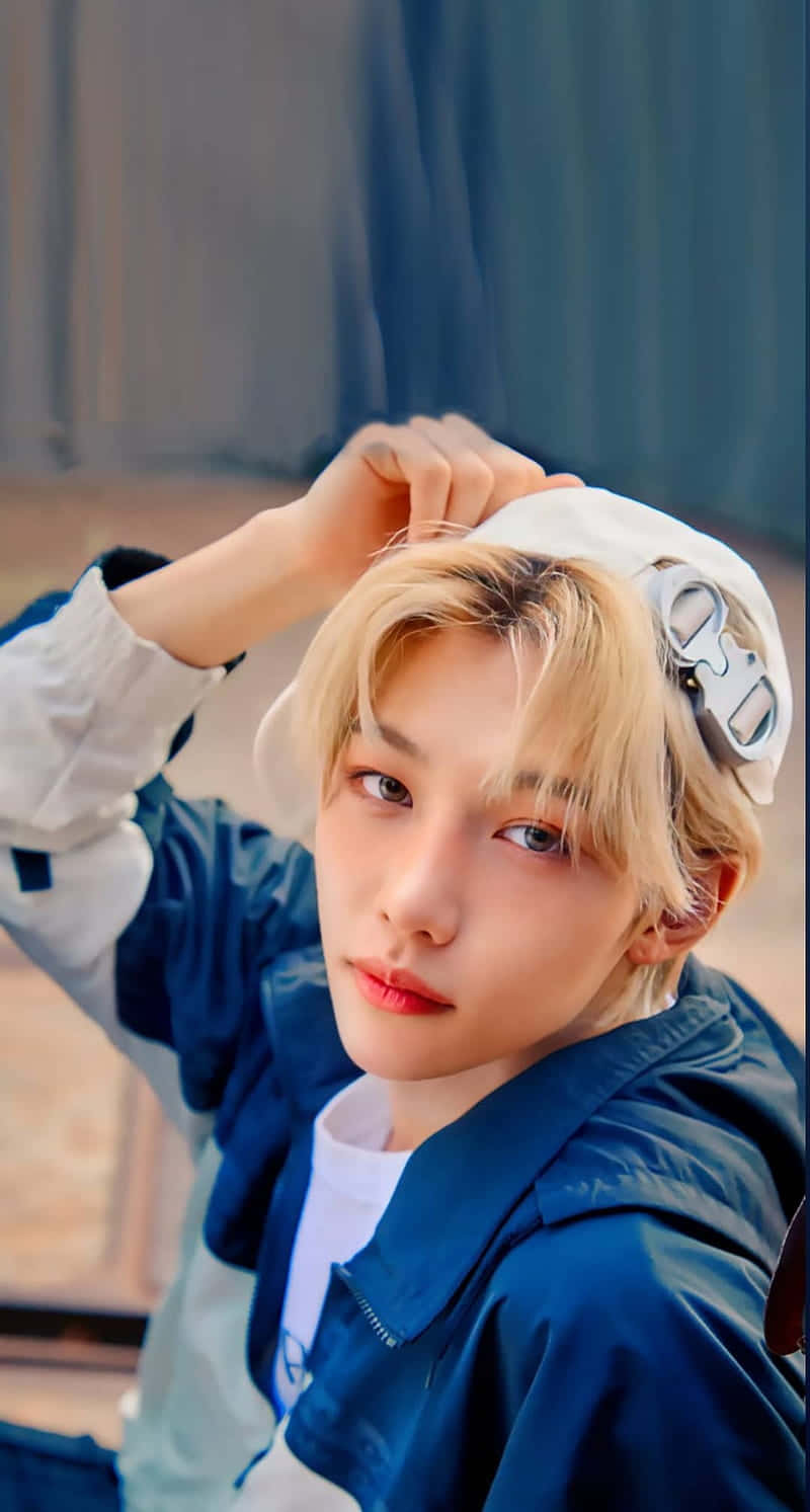 Felix Of Stray Kids Showing Off His Energy And Enthusiasm Wallpaper