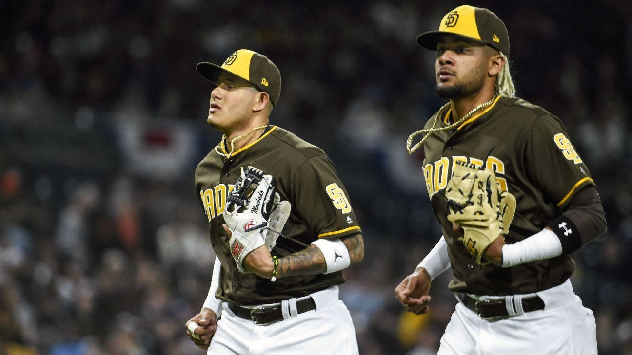 Fernando Tatis Jr. And Manny Machado In San Diego Padres Uniforms Wallpaper