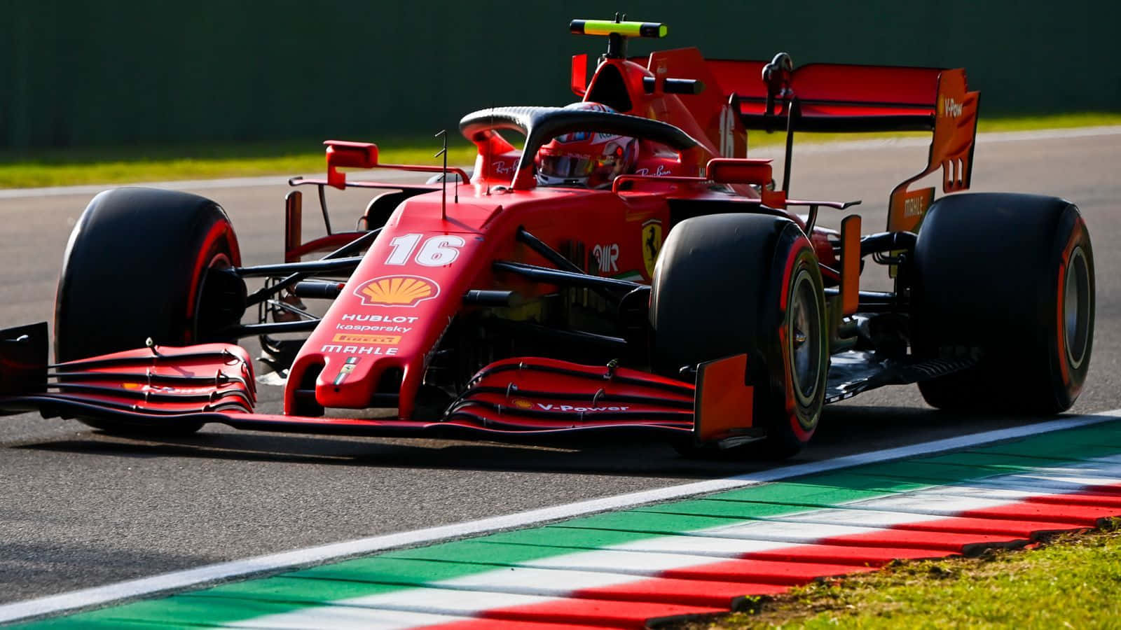 Ferrari F1 Car Driving On A Track Wallpaper