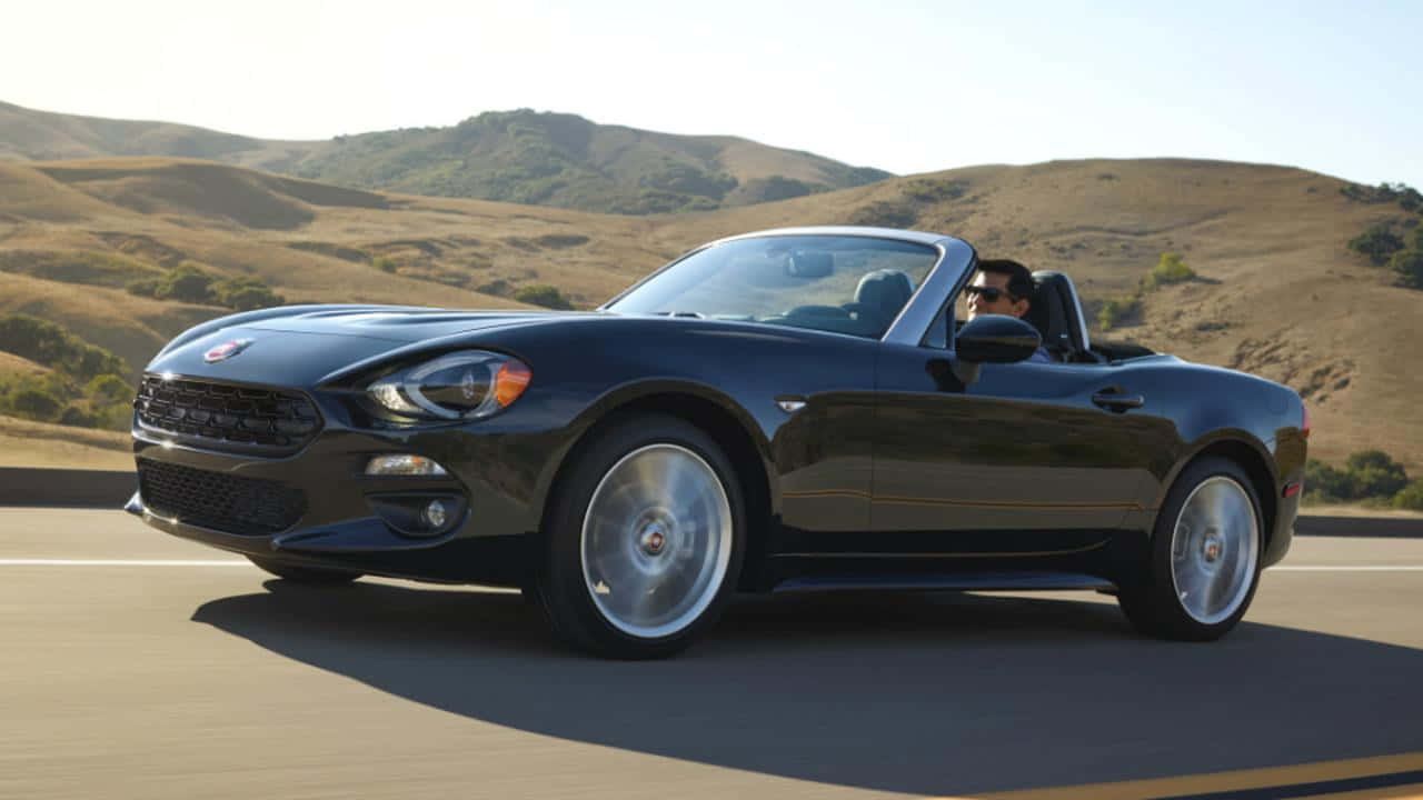 Fiat 124 Spider - Sleek, Stylish, And Timeless Design Wallpaper