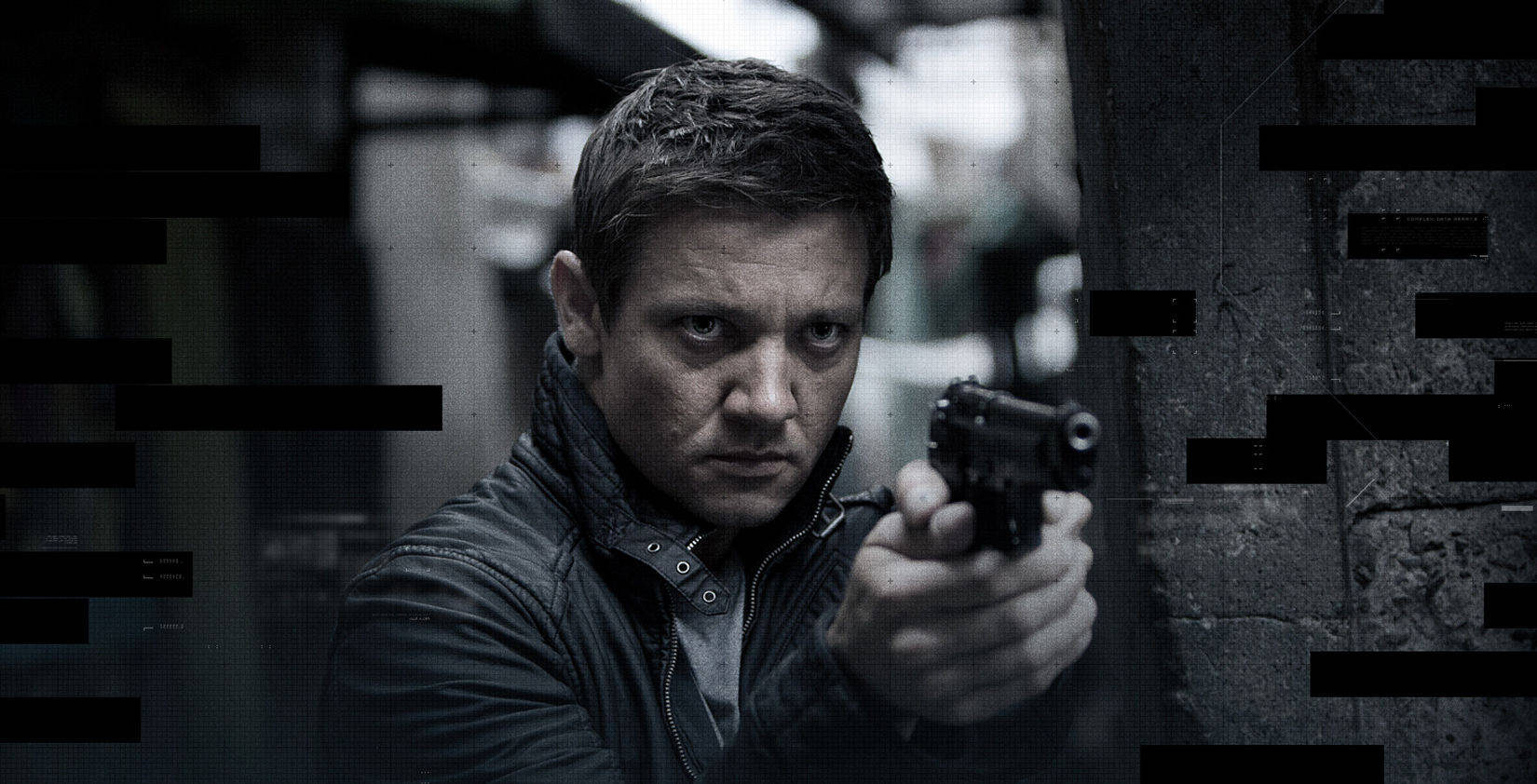 Fierce Jeremy Renner With A Gun Wallpaper