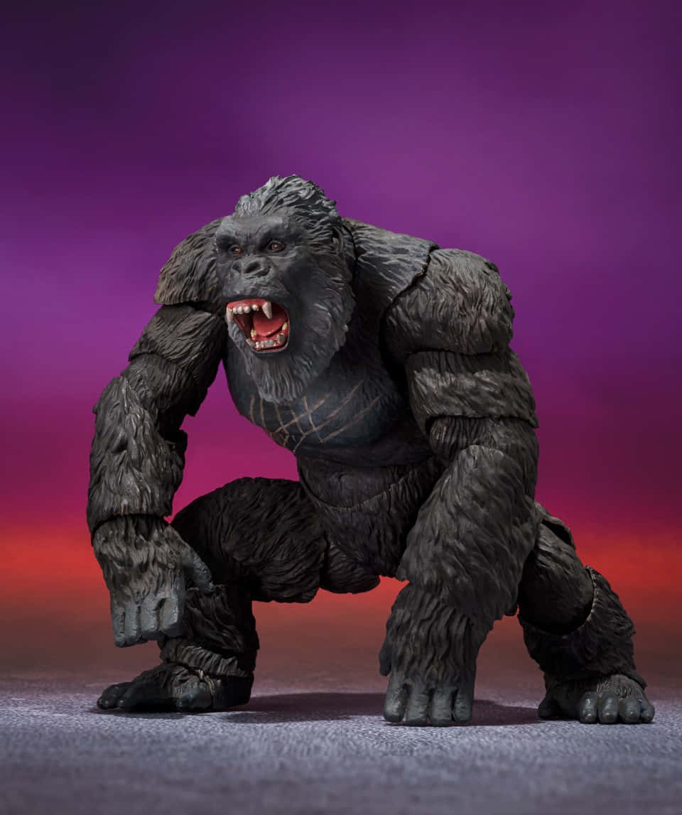 Fierce_ Kong_ Figure_ Against_ Purple_ Backdrop Wallpaper