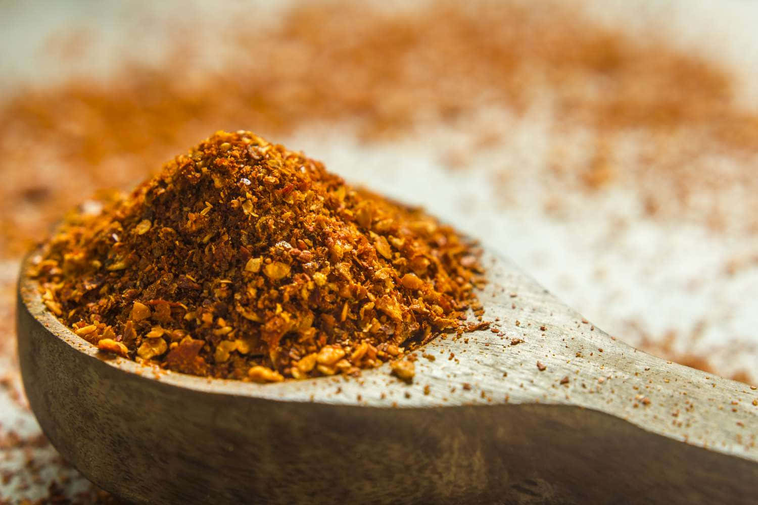 Fiery Red Chili Powder In A Bowl Wallpaper