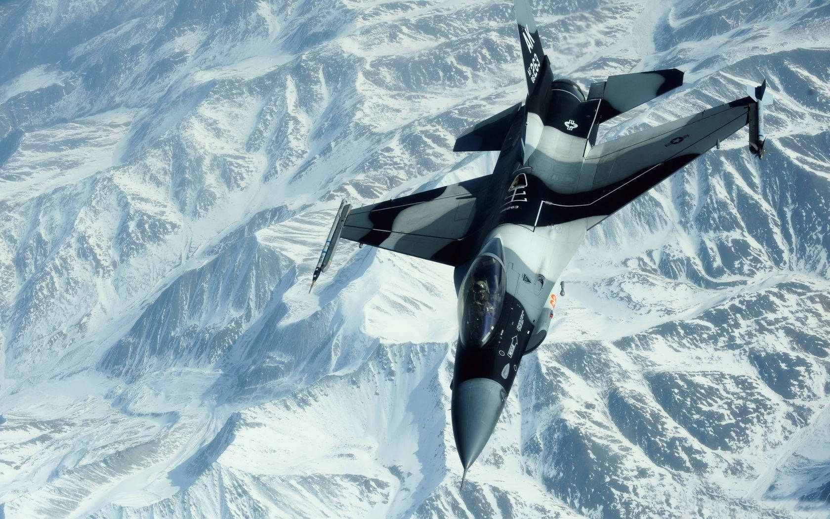 Fighter Jet Over The Snowy Mountains Wallpaper