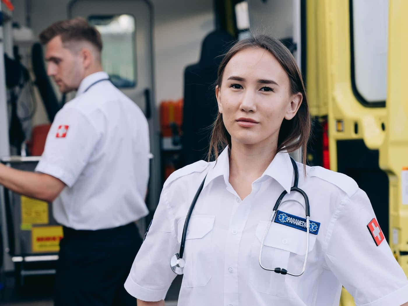 First Responder Paramedics Near Ambulance Wallpaper