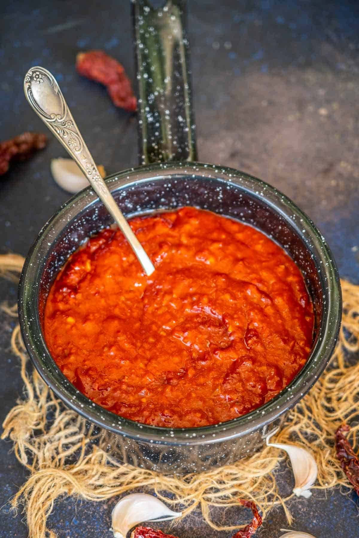 Flavorful Szechuan Sauce In A Bowl With White Background Wallpaper