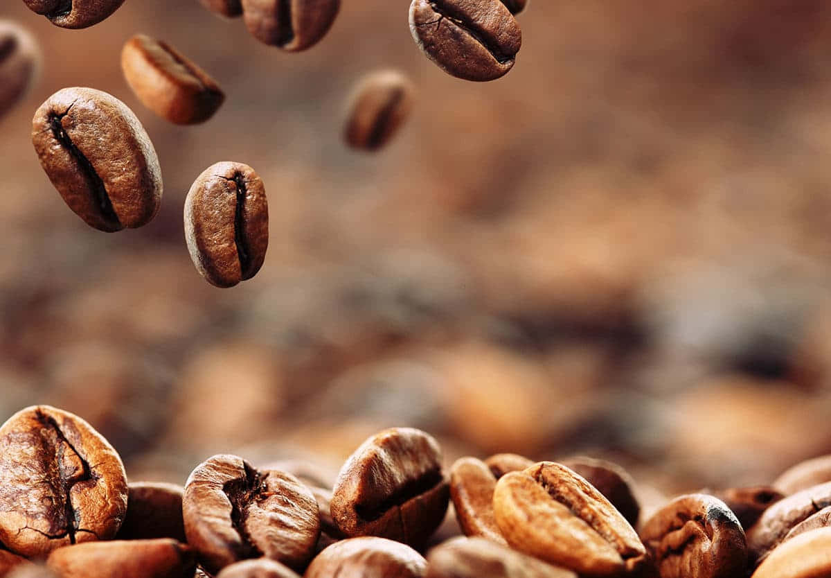 Floating Coffee Beans Celebrating International Coffee Day Wallpaper