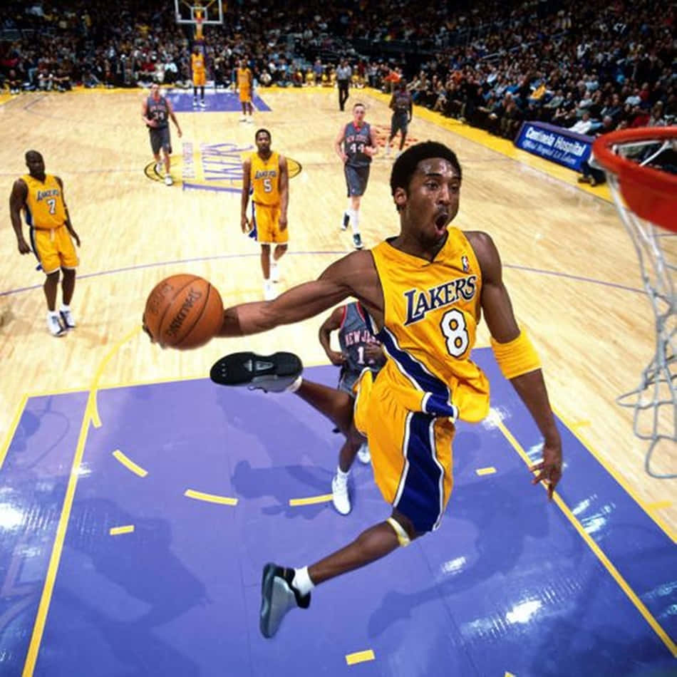 Flying High: Kobe Bryant's Legendary Dunk Wallpaper