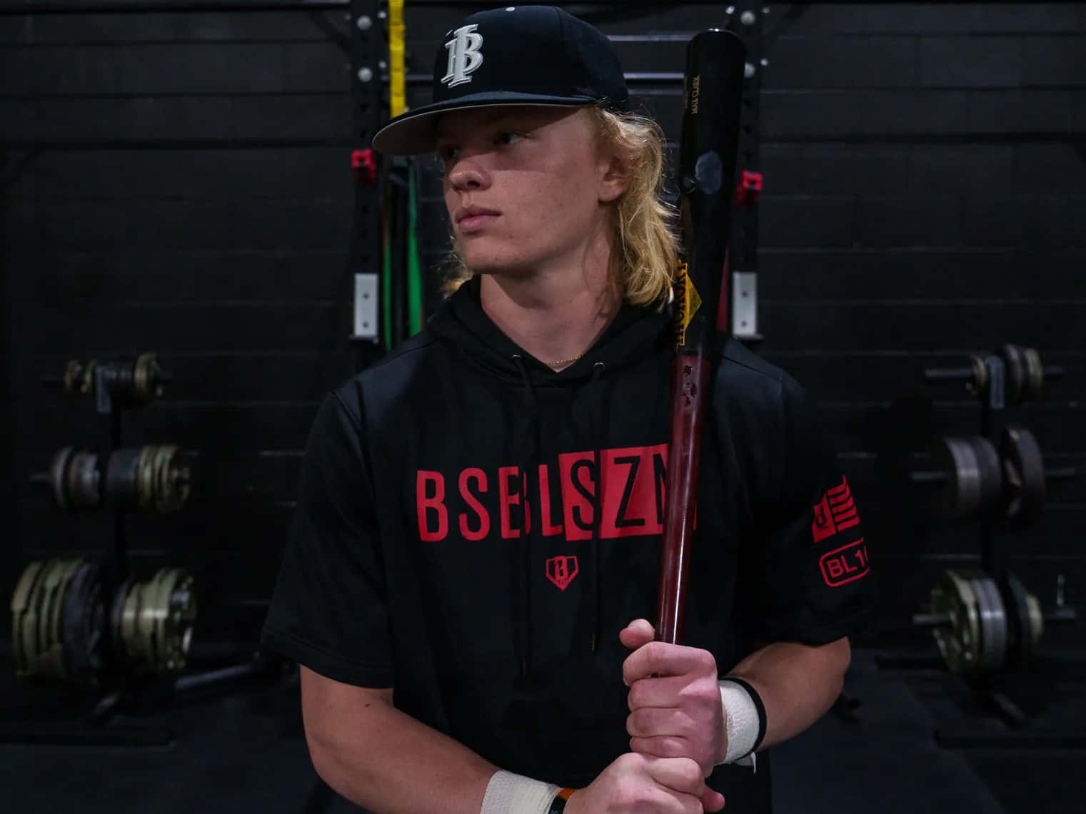 Focused Baseball Player In Gym Wallpaper