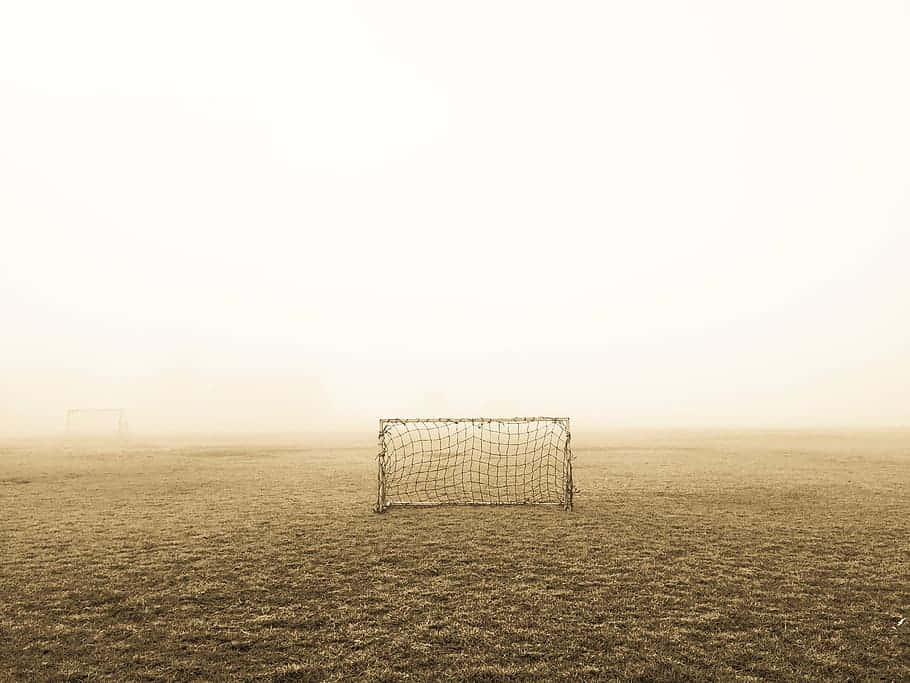 Foggy Soccer Fieldwith Goals.jpg Wallpaper