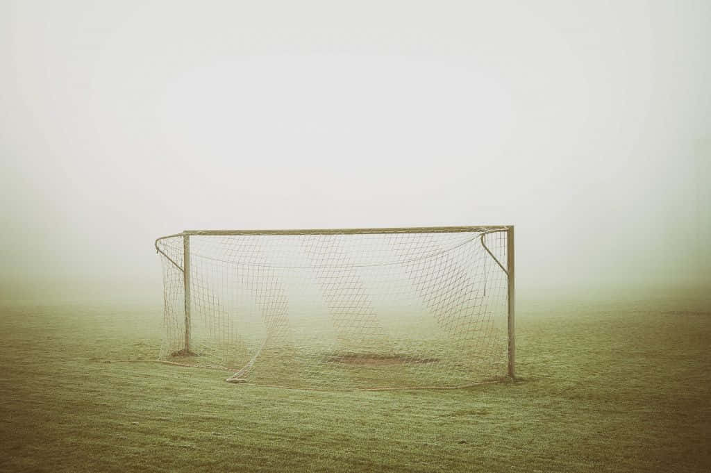 Foggy Soccer Goal Field Wallpaper