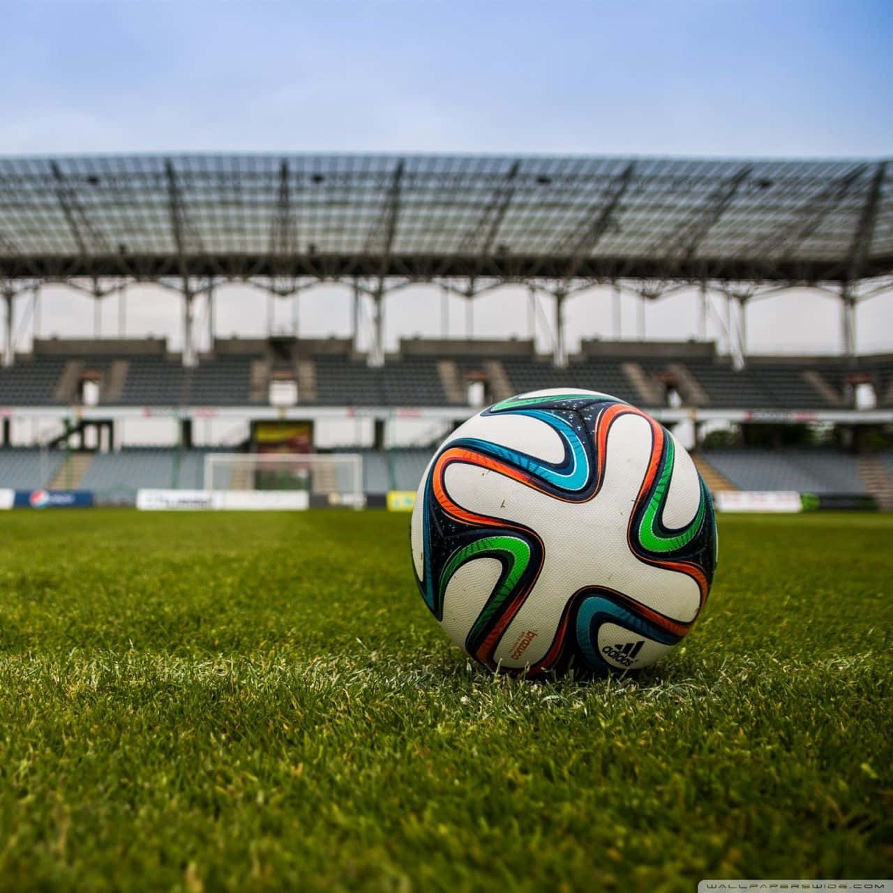 Football Galaxy Ball On Stadium Grassy Ground Wallpaper