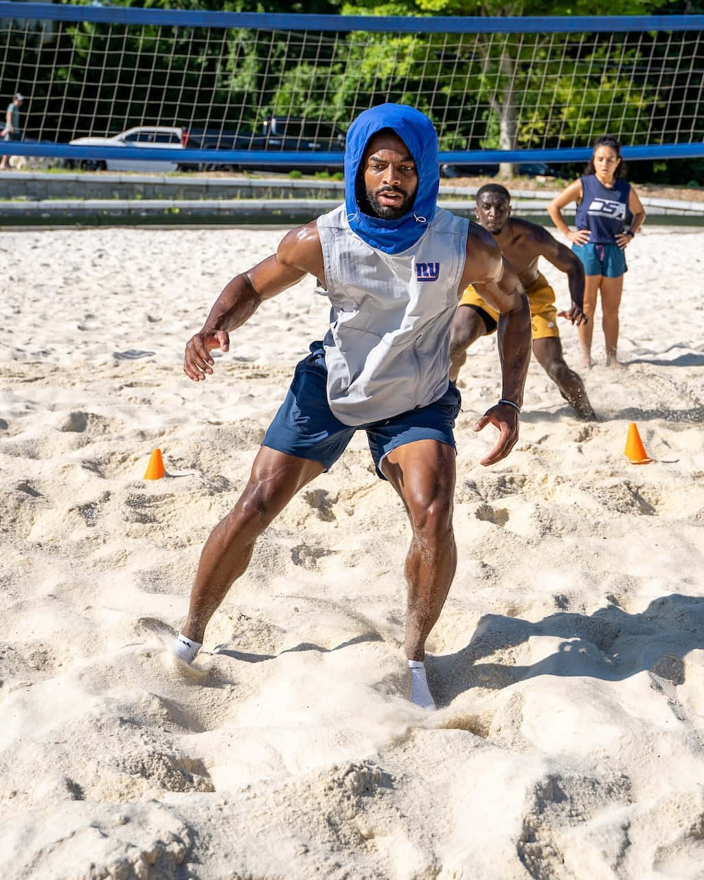 Football Player Beach Training Session Wallpaper