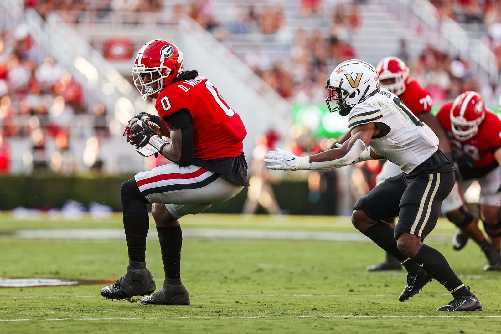 Football Player Catching Ball During Game Wallpaper