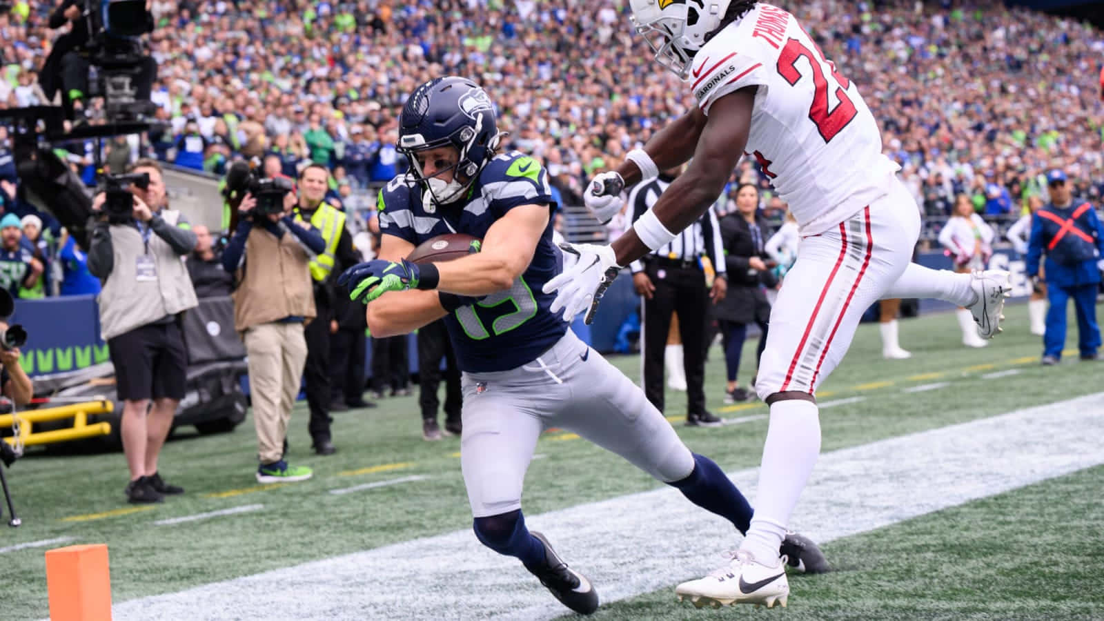 Football Player Catching Ball Near Endzone Wallpaper