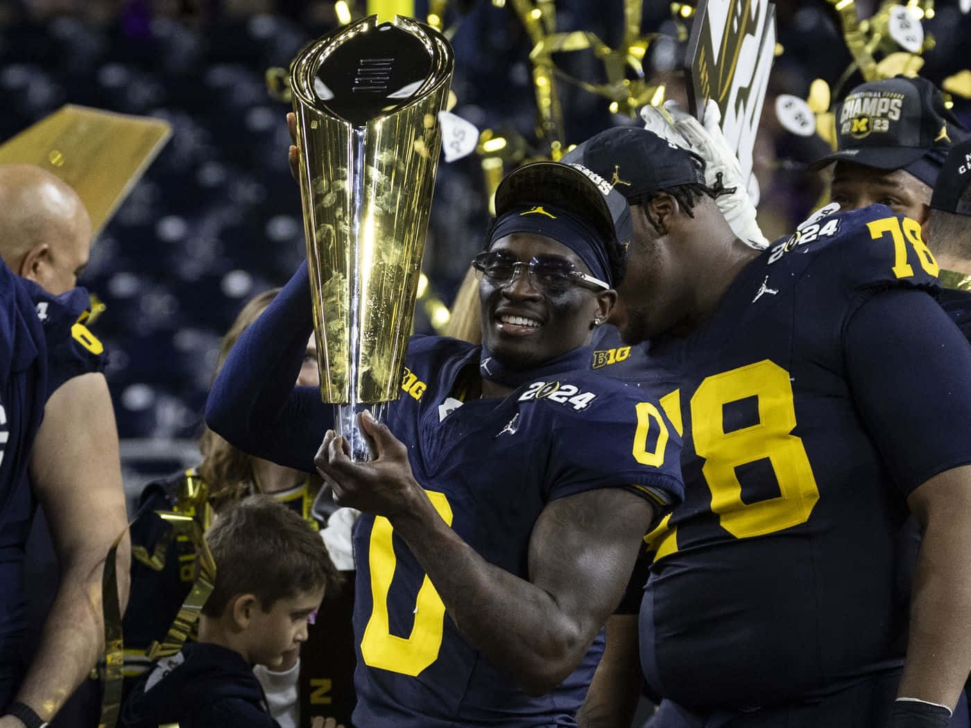 Football Player Celebratingwith Trophy Wallpaper