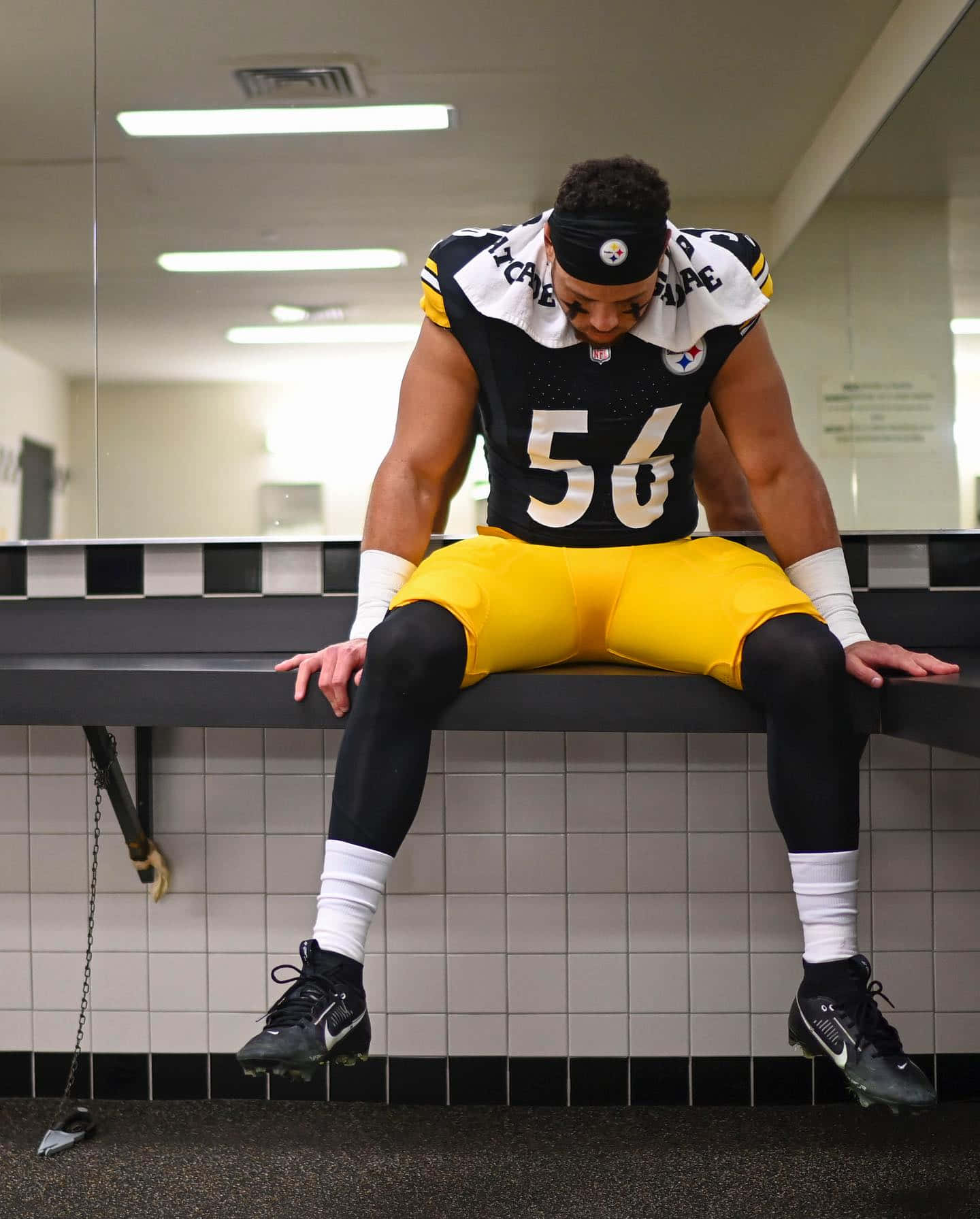 Football Player Locker Room Reflection Wallpaper