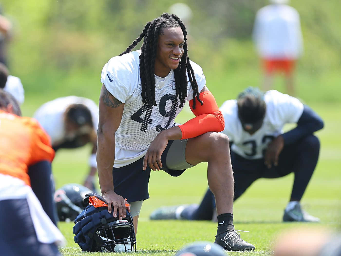 Football Player Resting During Practice Wallpaper